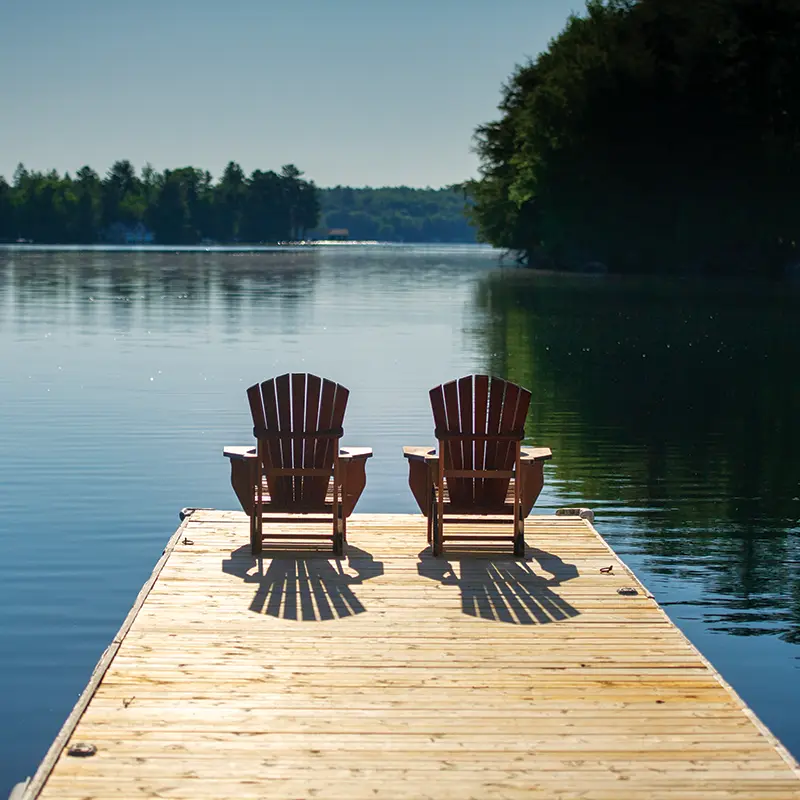 chairs on dock at lake